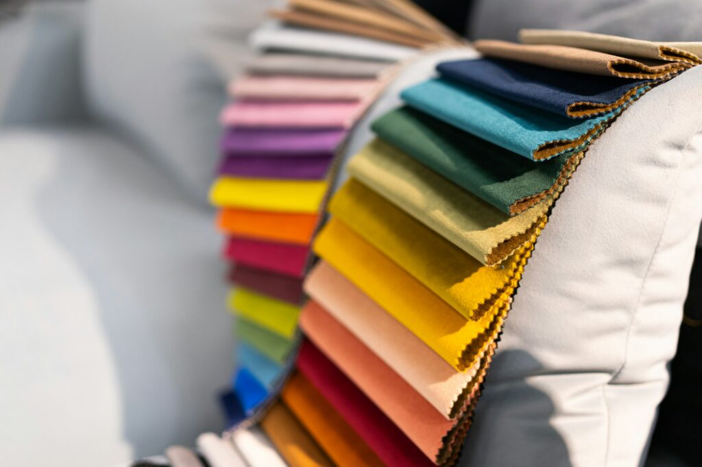 Catalog of multi-colored fabric samples. Textile industry background. Colored cotton fabric. Palet